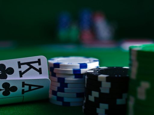 white and black dice on green table